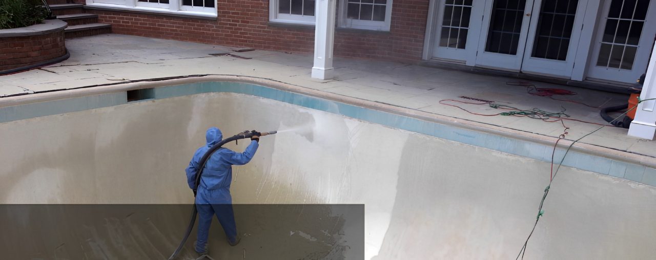 Cleaning empty pool with power washer